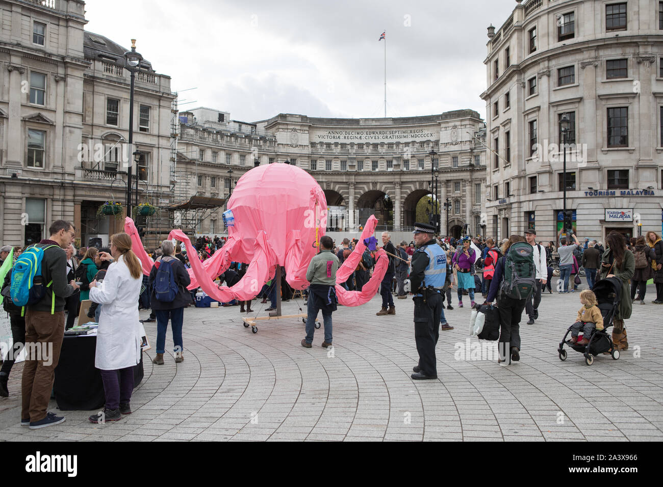 Westminster, London, UK. 10 October 2019. Environmental campaigners Extinction Rebellion have started two weeks protests from 7th to 20th October in and around London to demonstrate against climate change. The protesters in Trafalgar Square demand decisive action from the UK Government on the global environmental crisis. The controversial pink Octopus is moved around in the square. Stock Photo