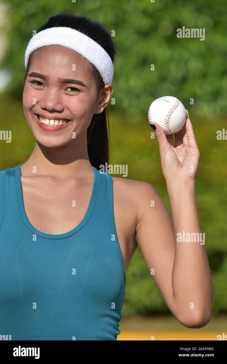 Sporty Minority Female Baseball Player Smiling Stock Photo