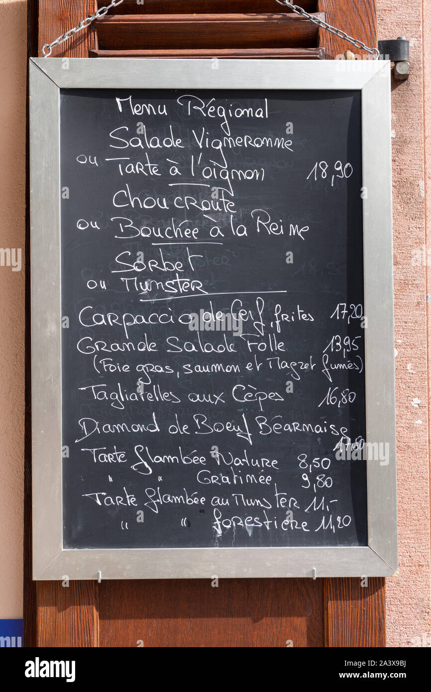 A menu on a blackboard for a radyional restaurant in Eguisheim Alsace showing regional french food Stock Photo