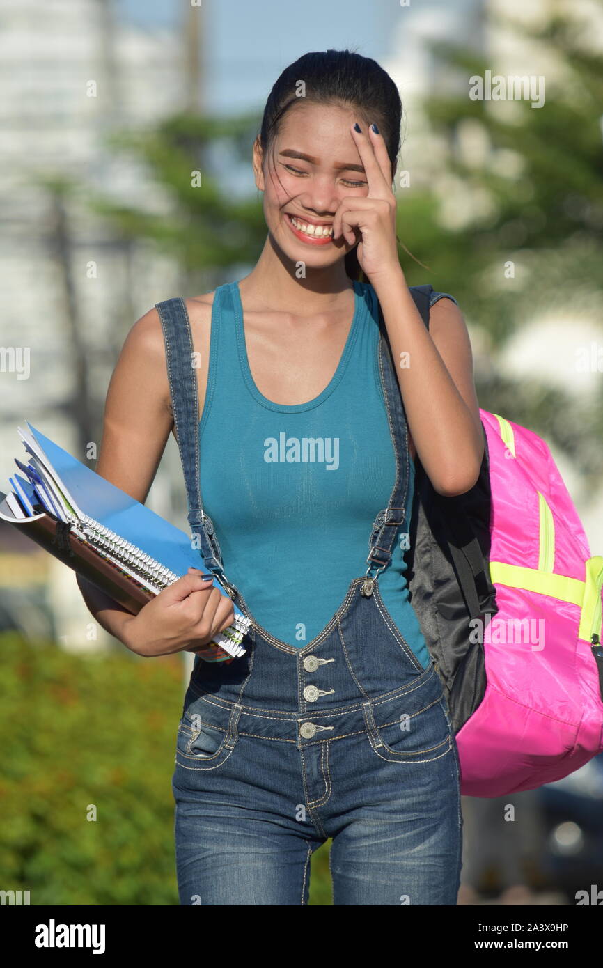 College Student Laughing With Notebooks Stock Photo