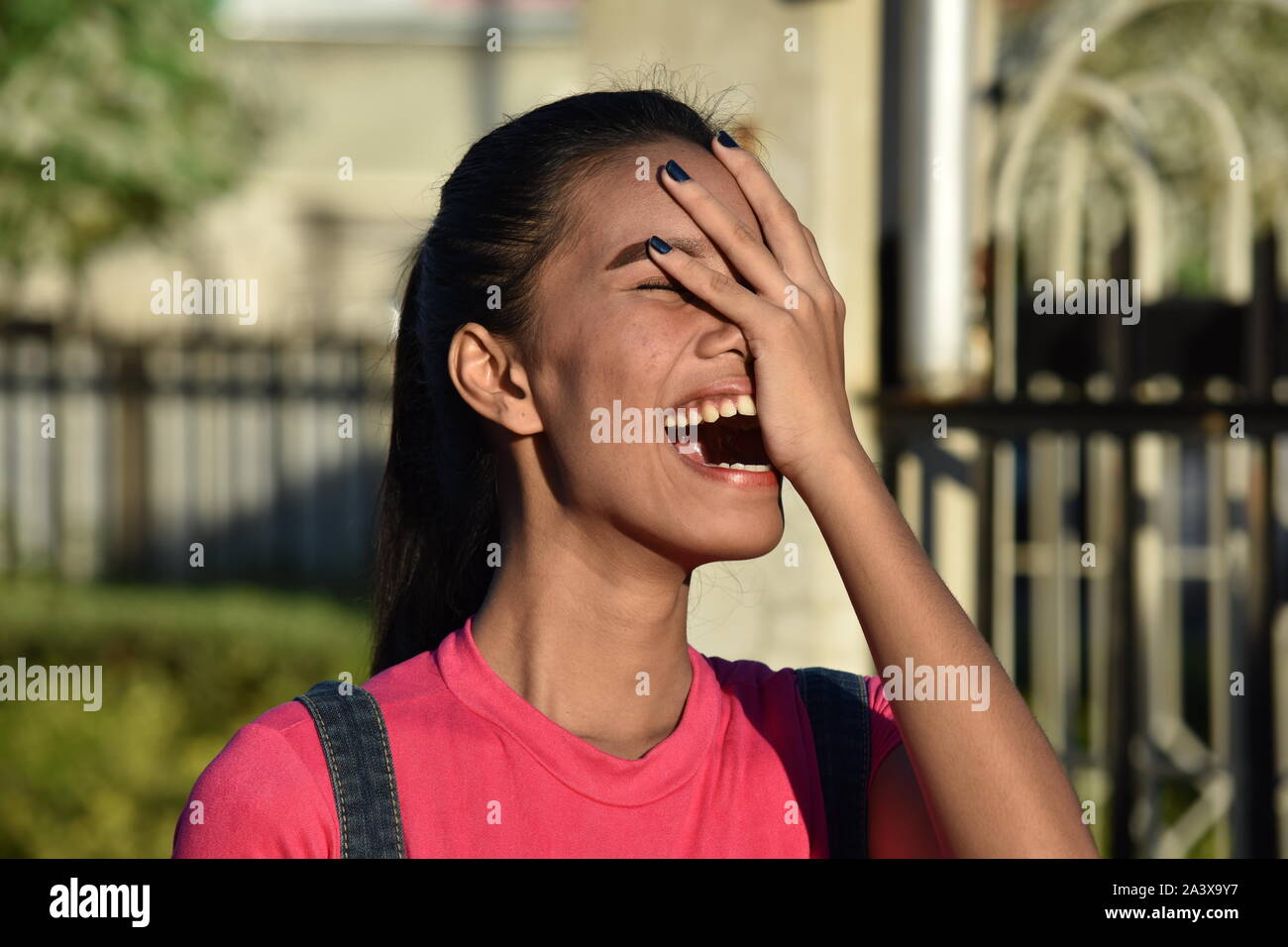 An Attractive Filipina Woman And Laughter Stock Photo