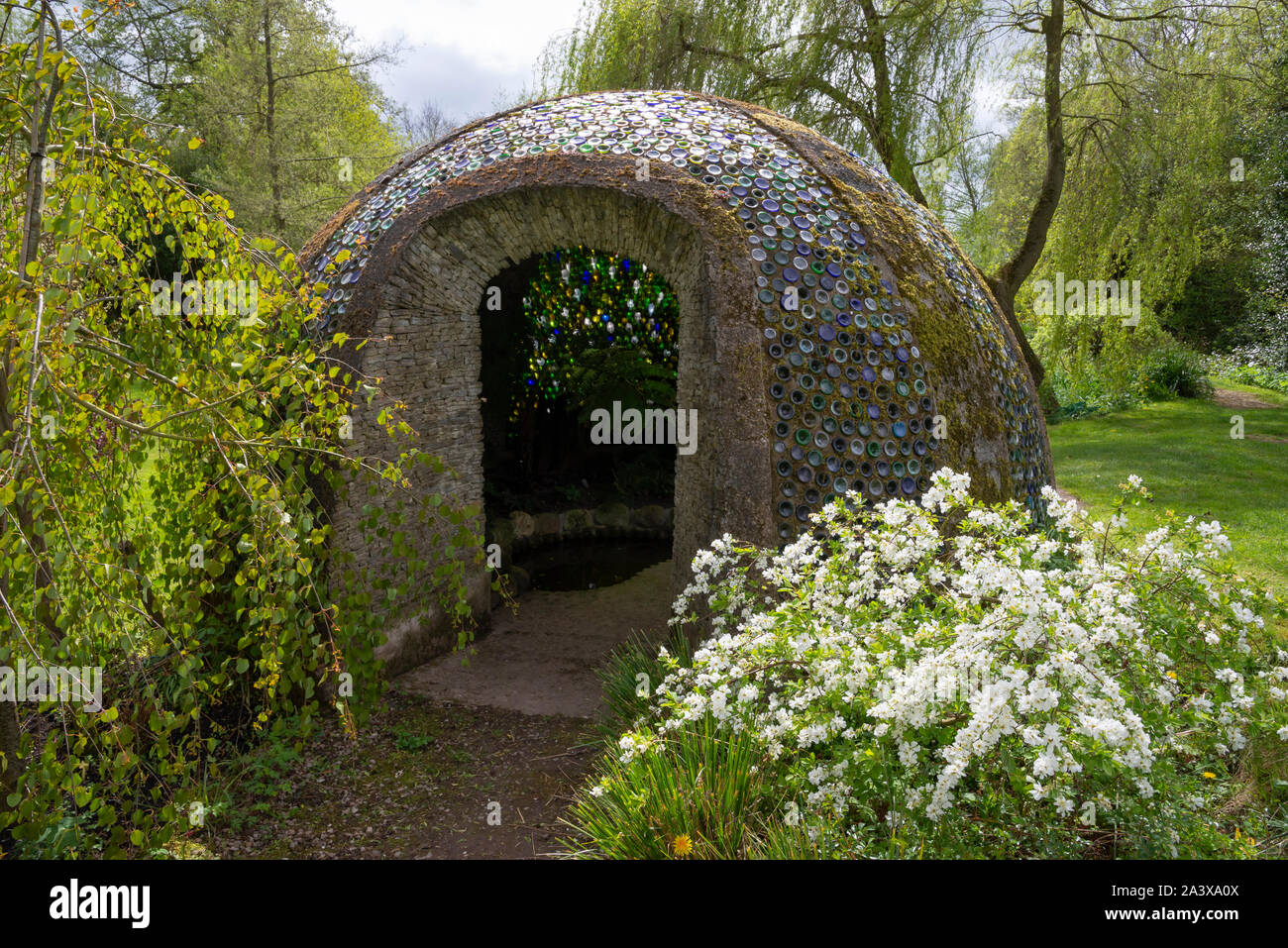 Westonbury Mill water gardens, Herefordshire, England. Unusual domed sculpture made from coloured glass bottles. Stock Photo