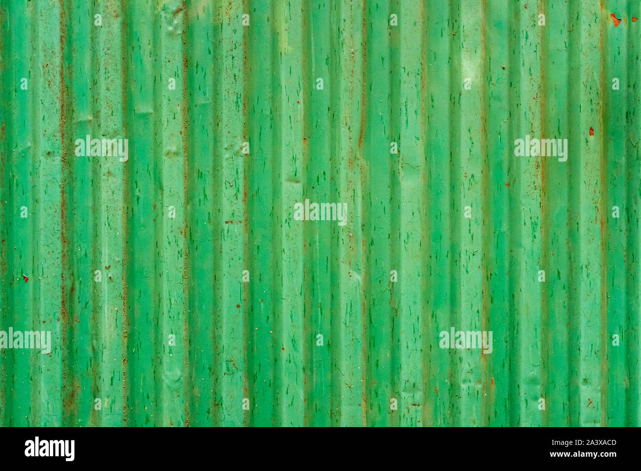Green corrugated shipping container back. Old shipping container background texture. Stock Photo