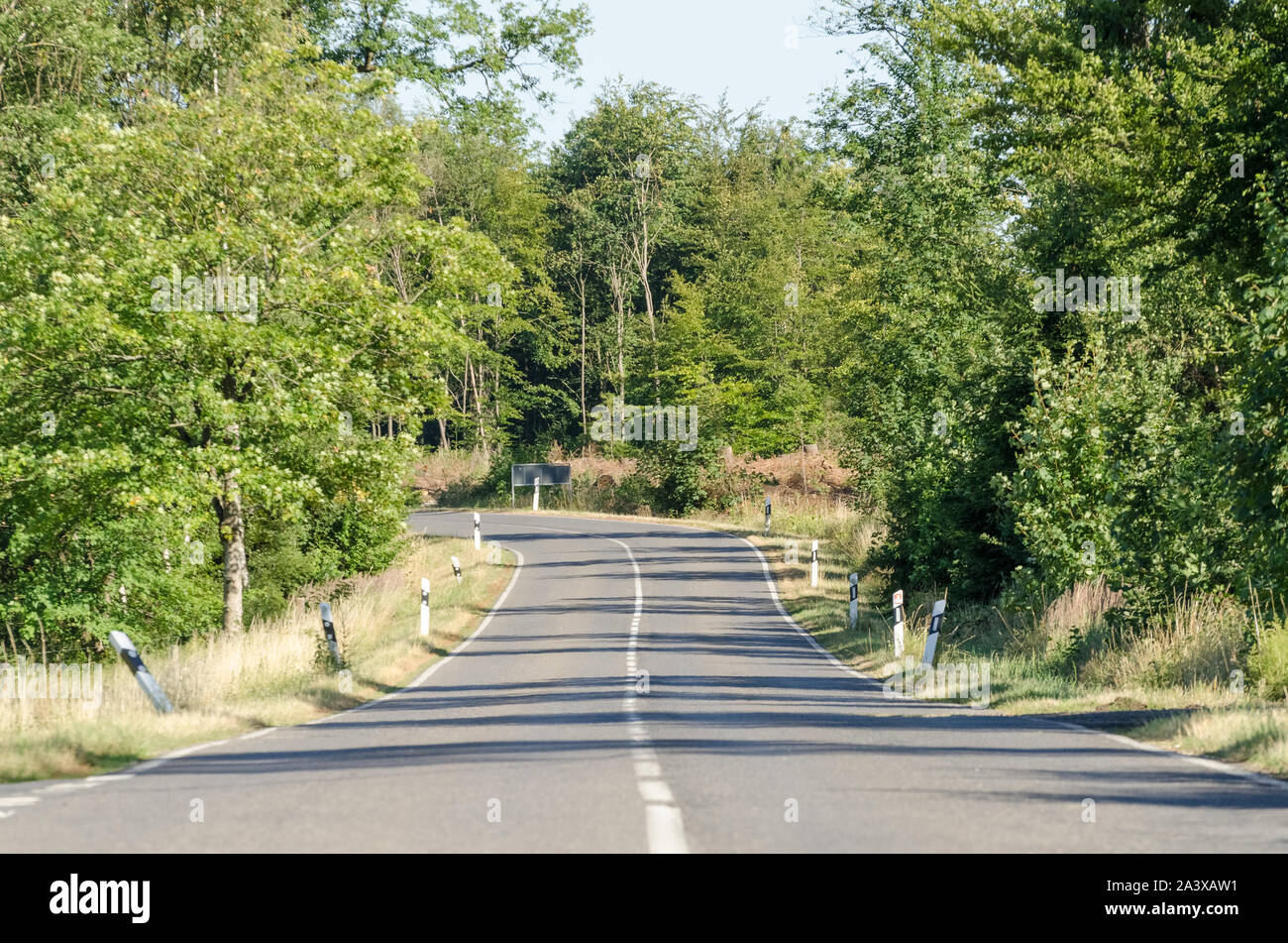 Empty road with delineators and markings in the countryside in Germany