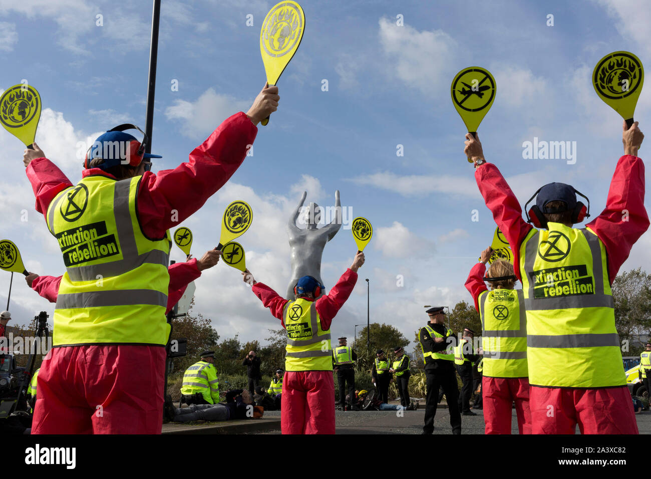 Environmental activist protest about Climate Change during the occupation of City Airport (London's Business Travel hub) in east London, the fourth day of a two-week prolonged worldwide protest by members of Extinction Rebellion, on 10th October 2019, in London, England. Stock Photo
