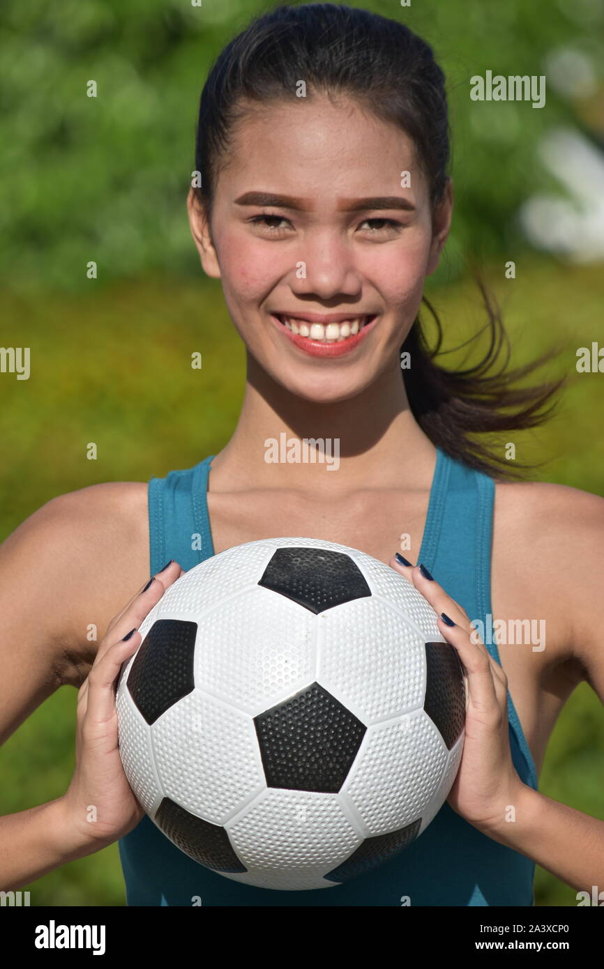 Smiling Fitness Female Soccer Player Stock Photo