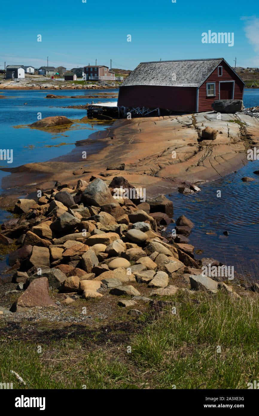 Slanted old red stage shed in Tilting, Fogo Island, Newfoundland Stock Photo