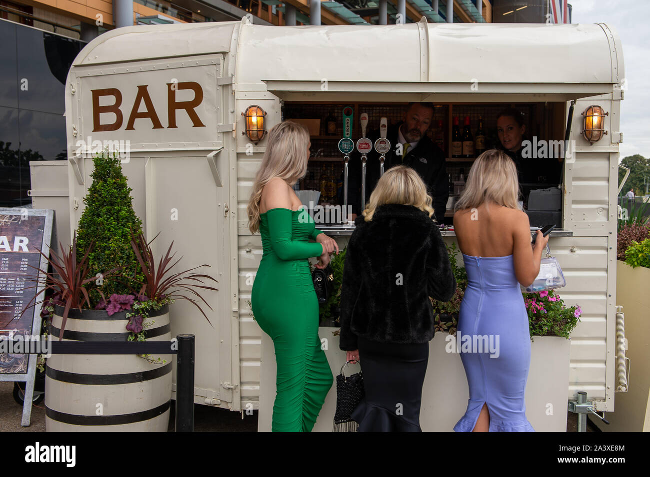 Autumn Racing Weekend & Ascot Beer Festival, Ascot Racecourse, Ascot, Berkshire, UK. 5th October, 2019. Three ladies getting drinks at Ascot. Credit: Maureen McLean/Alamy Stock Photo