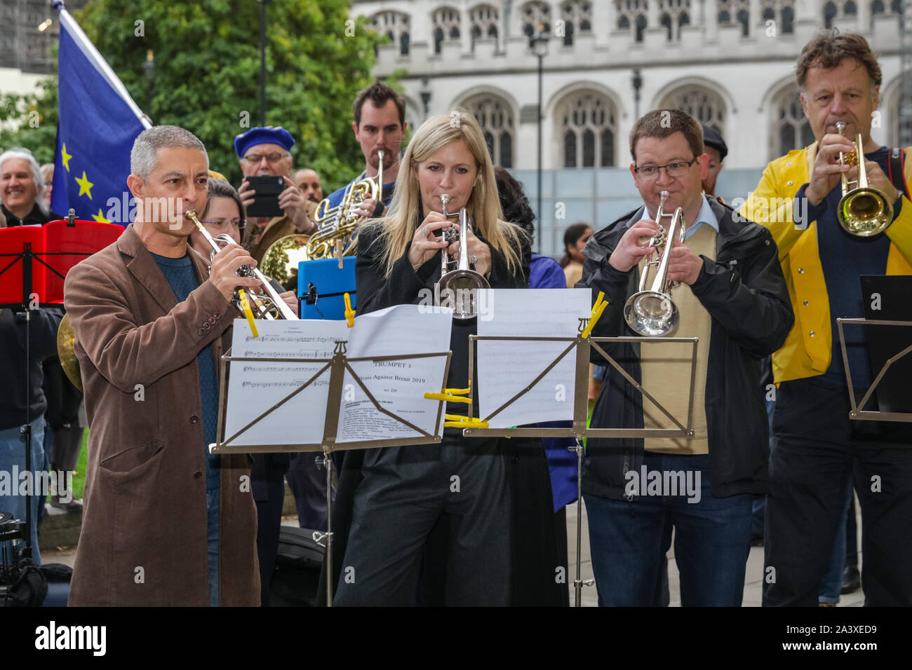 London, UK. 10th Oct, 2019. Trumpeter Alison Balsom performs with a sizeable brass ensemble, conducted by English National Opera conductor Martyn Brabbins and many notable musicians in Parliament Square as 'Brass against Brexit' to protest for continued musicians rights and against Brexit. Credit: Imageplotter/Alamy Live News Stock Photo