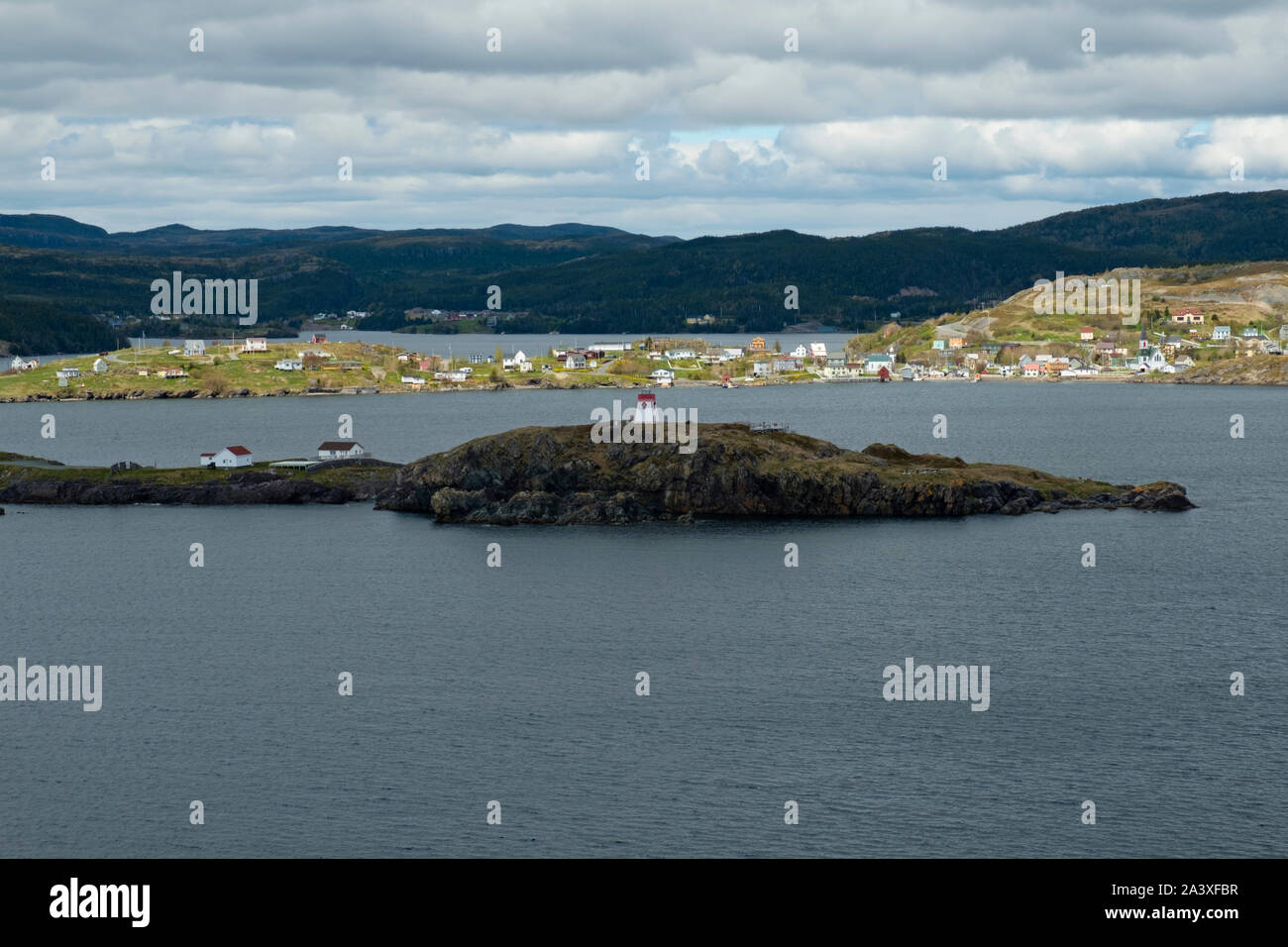 View of Trinity from Skerwink Trail, with lighthouse in foreground, Newfoundland Stock Photo