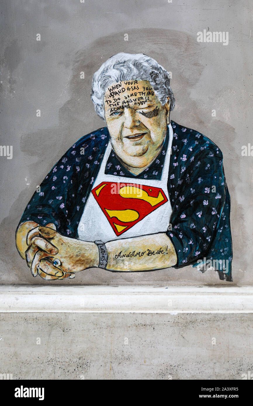 Defaced street art poster of Sora Lella by Lediesis in Trastevere district of Rome, Italy Stock Photo