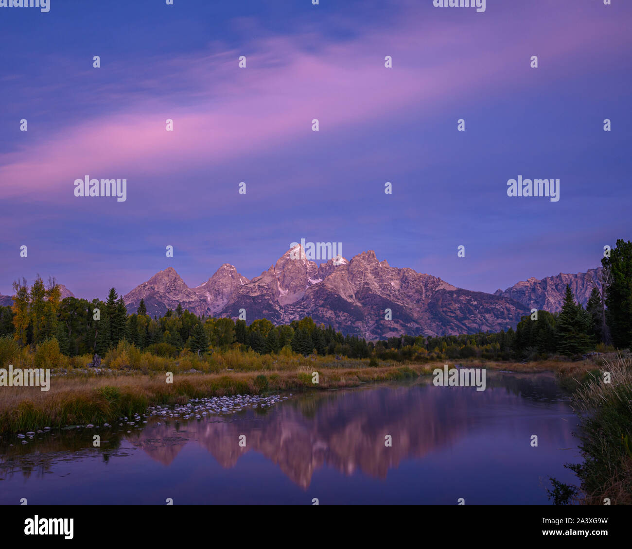 The Teton Mountains at dawn from Lower Schwabacher Landing in Grand Teton National Park, Wyoming, USA. Stock Photo