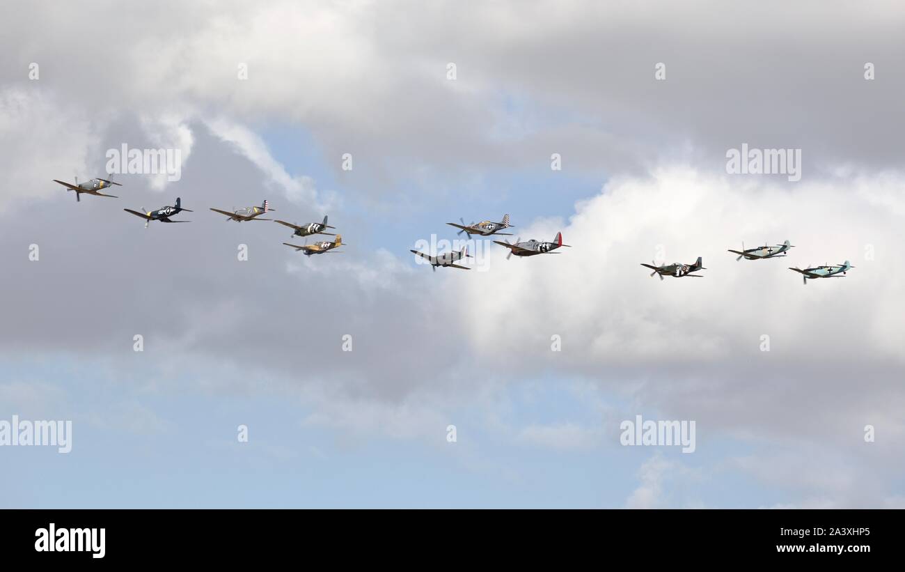 Amazing collection of historical World War Two aircraft performing a spectacular Balbo (aircraft formation) at the 2019 Flying Legends Airshow Stock Photo