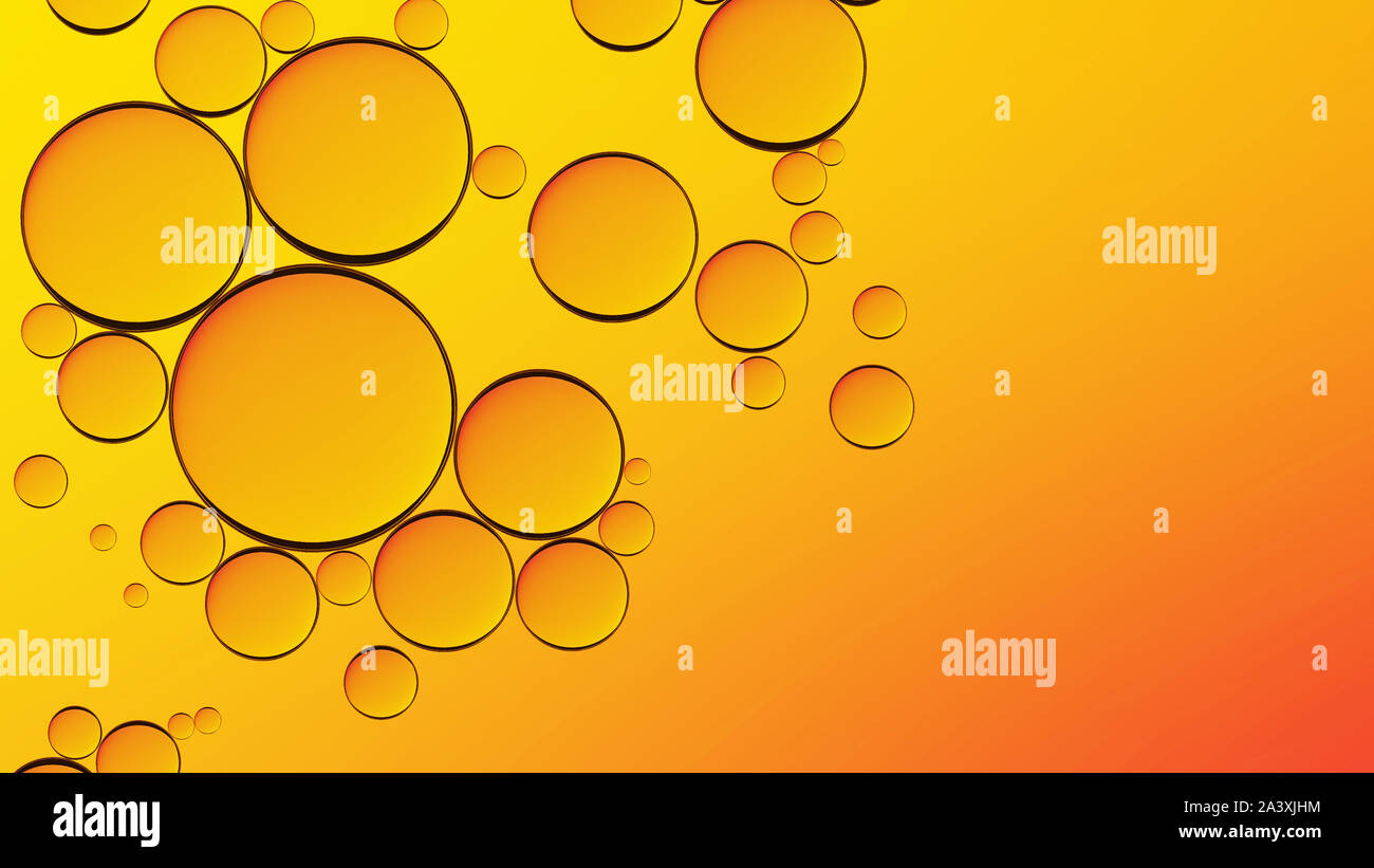 Water in oil in abstract style on yellow background. Orange liquid splash. Golden yellow bubble oil abstract background. Stock Photo