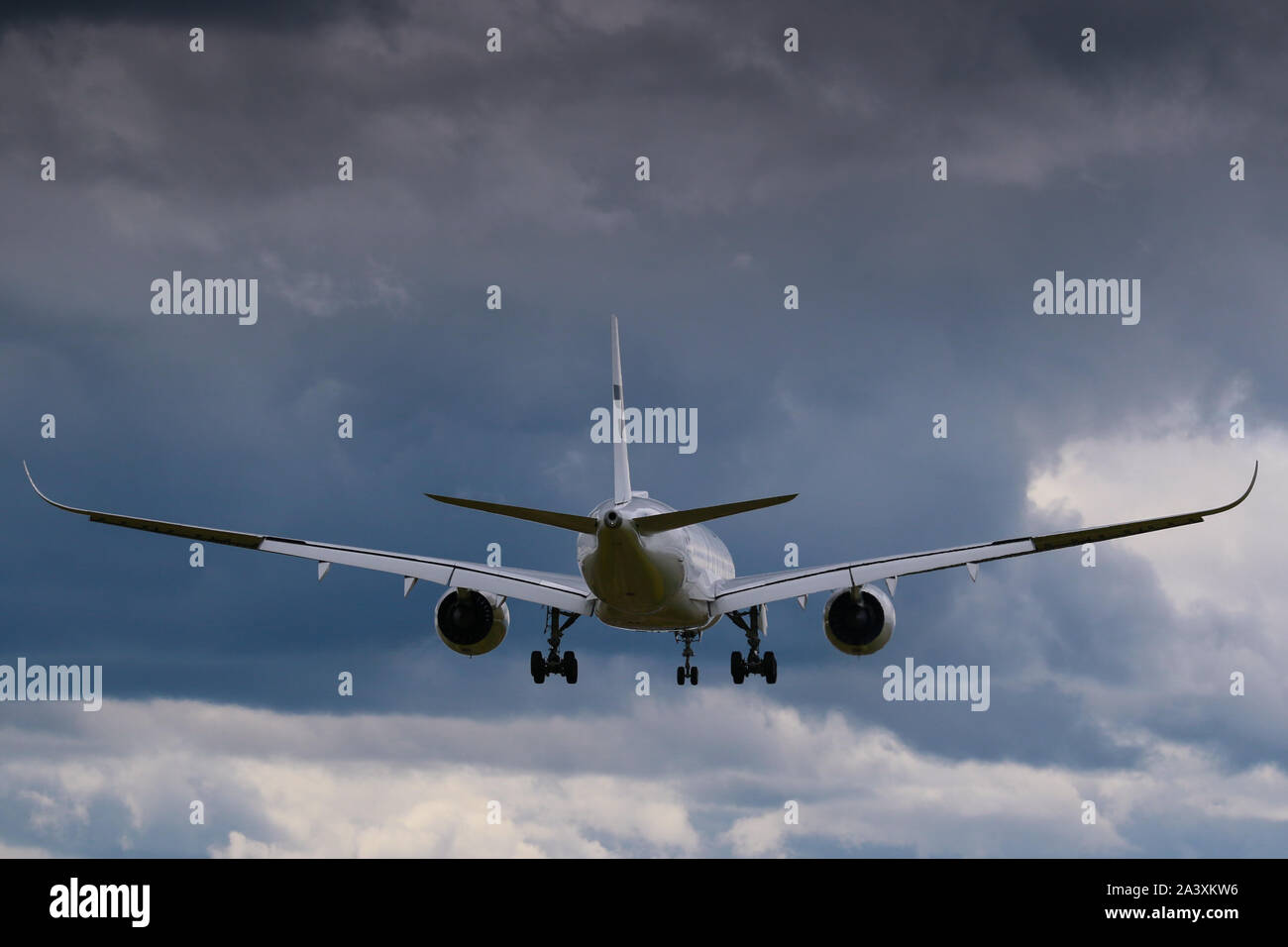 Commercial airplane in the air Stock Photo