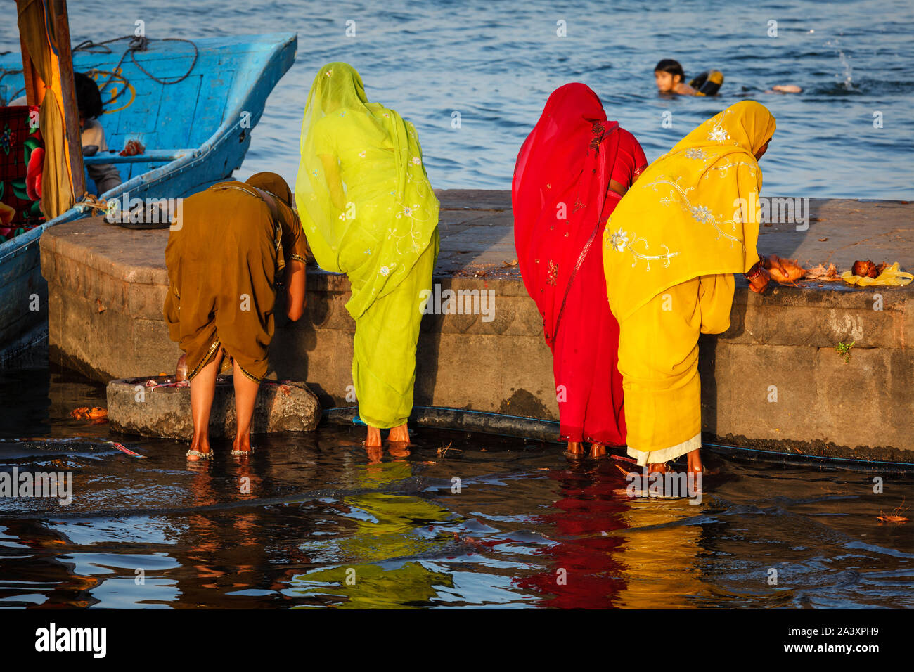 Women doing morning pooja Stock Photo