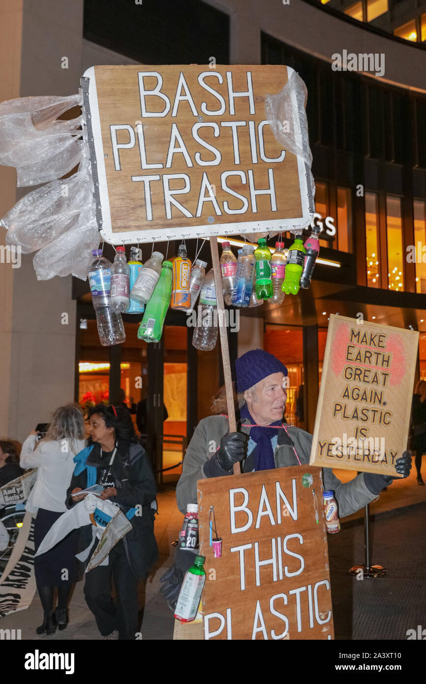 London, UK, 10 Oct 2019. Extinction Rebellion protesters from London XR groups, including the XR drummers, protest outside the British Plastics Federation (BPF) annual dinner at the Royal Lancaster Hotel this evening. The event is an annual industry and networking event for the plastics industry. Many of the attendees interact and chat to protesters on this occasion. Credit: Imageplotter/Alamy Live News Stock Photo