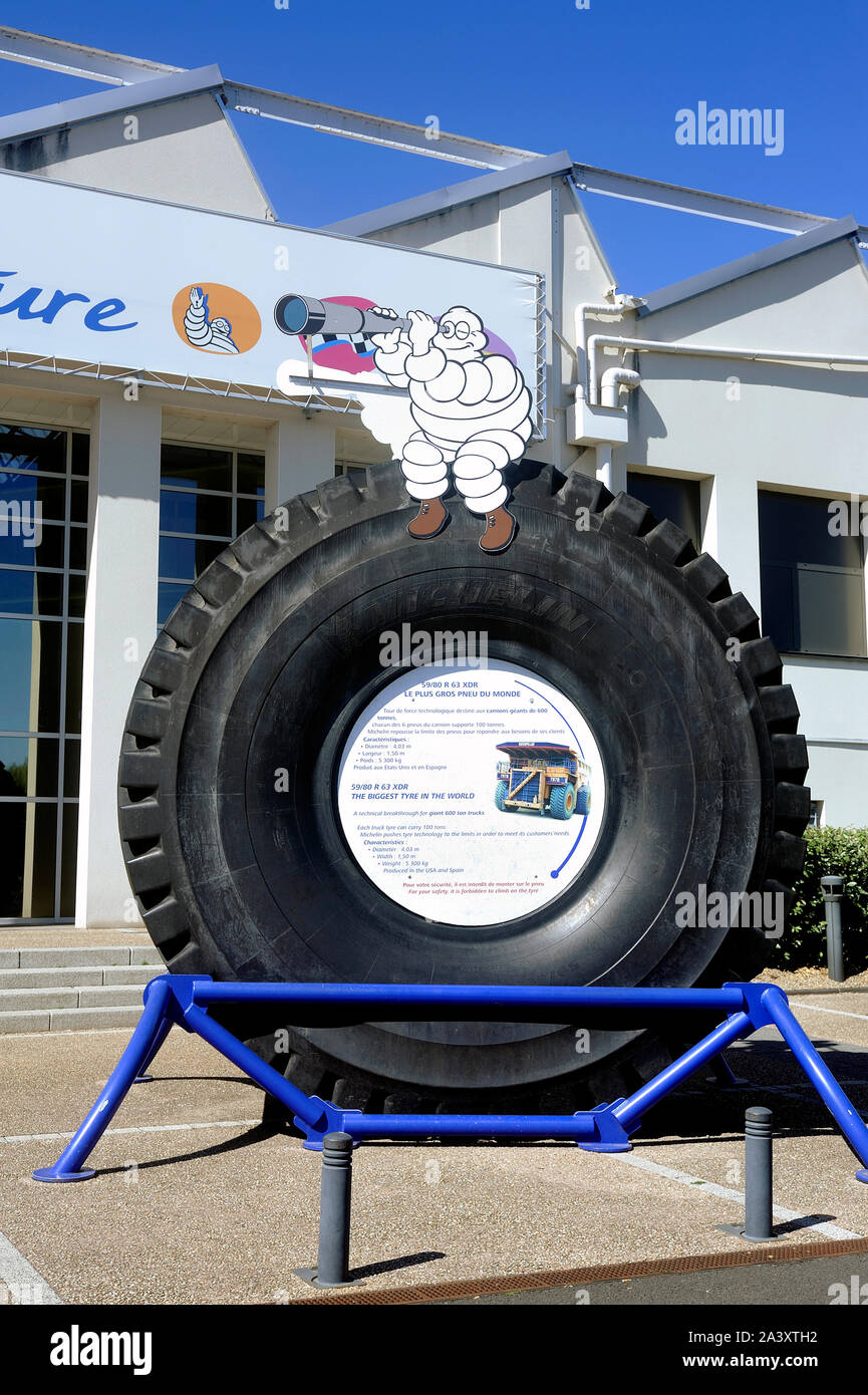 Large tire of mine engine exposed at the entrance of the Michelin Museum in Clermont-Ferrand Stock Photo