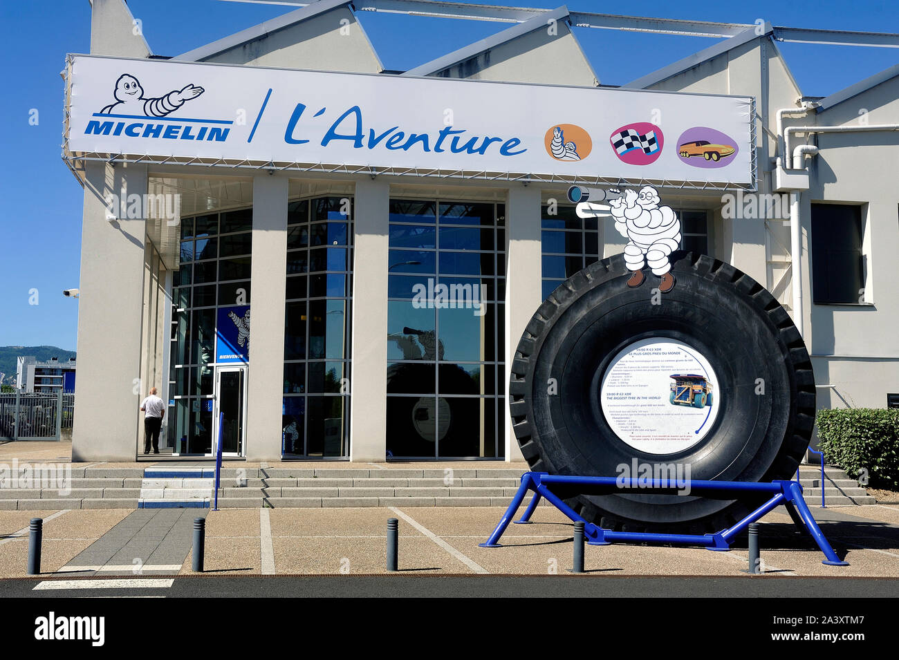 Large tire of mine engine exposed at the entrance of the Michelin Museum in Clermont-Ferrand Stock Photo