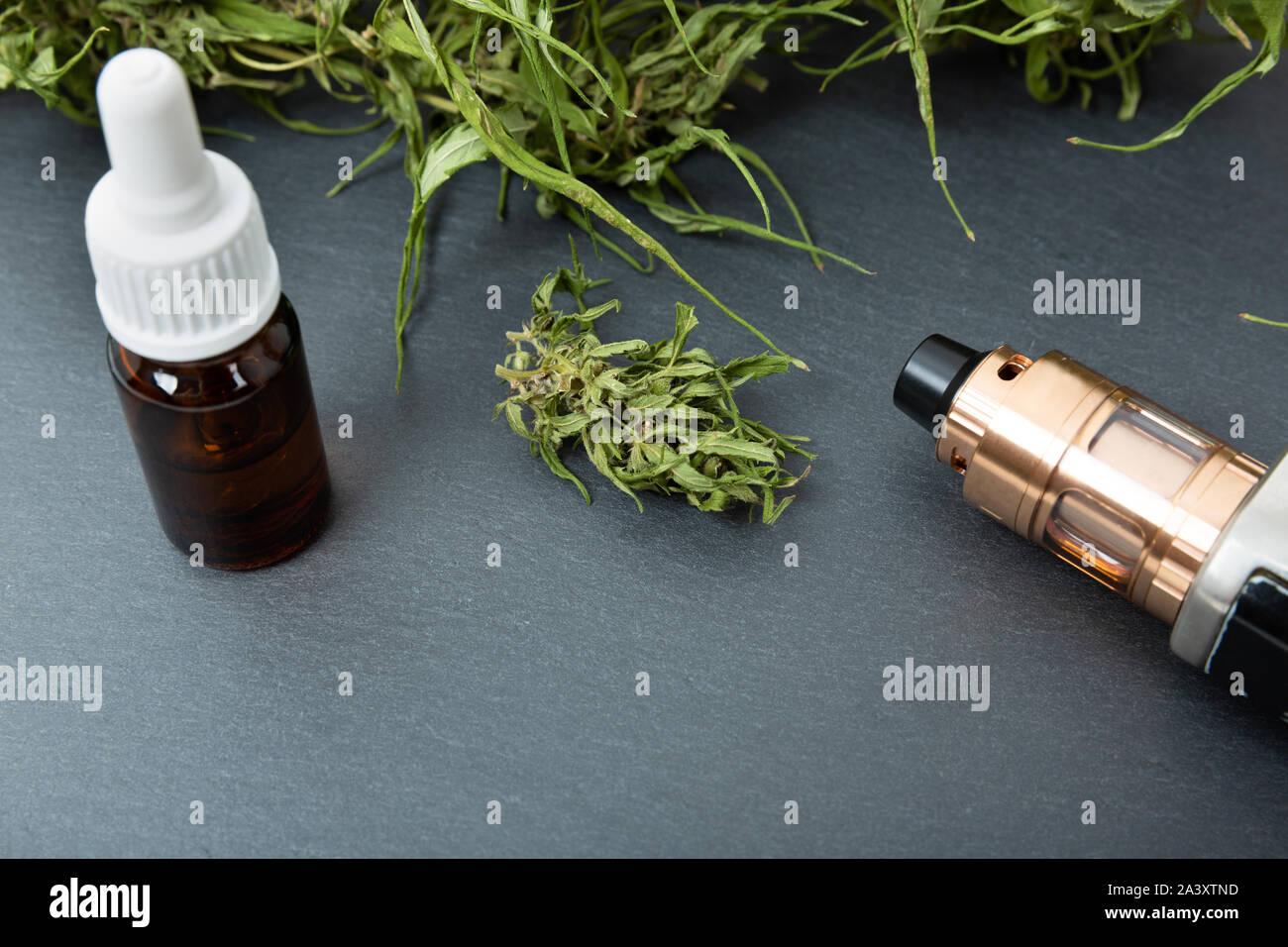 Vape pen and medical marijuana hemp bud. CBD and THC oil vaping products  Stock Photo - Alamy