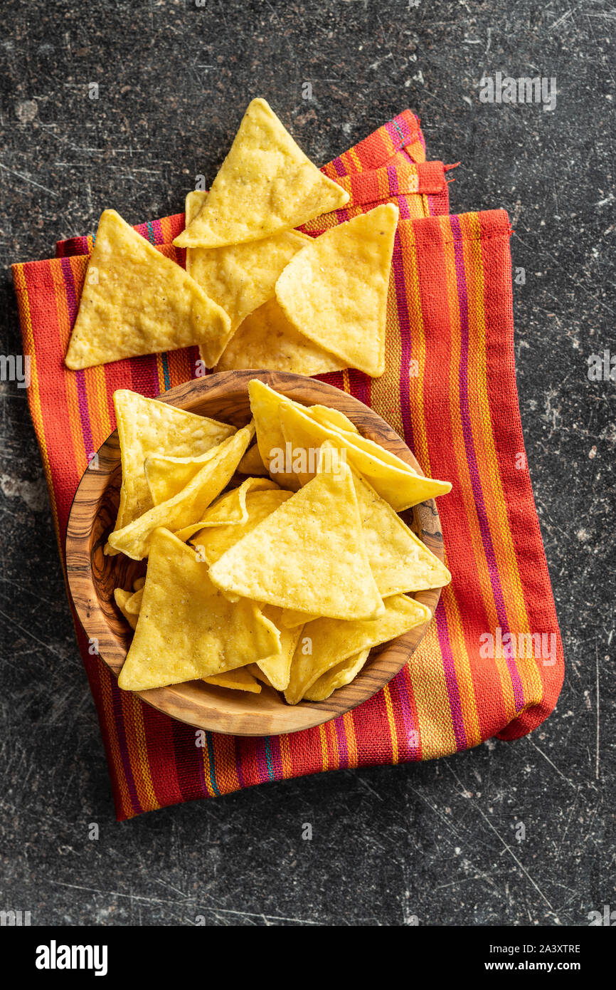 Corn nacho chips. Yellow tortilla chips in wooden bowl. Top view Stock Photo Alamy