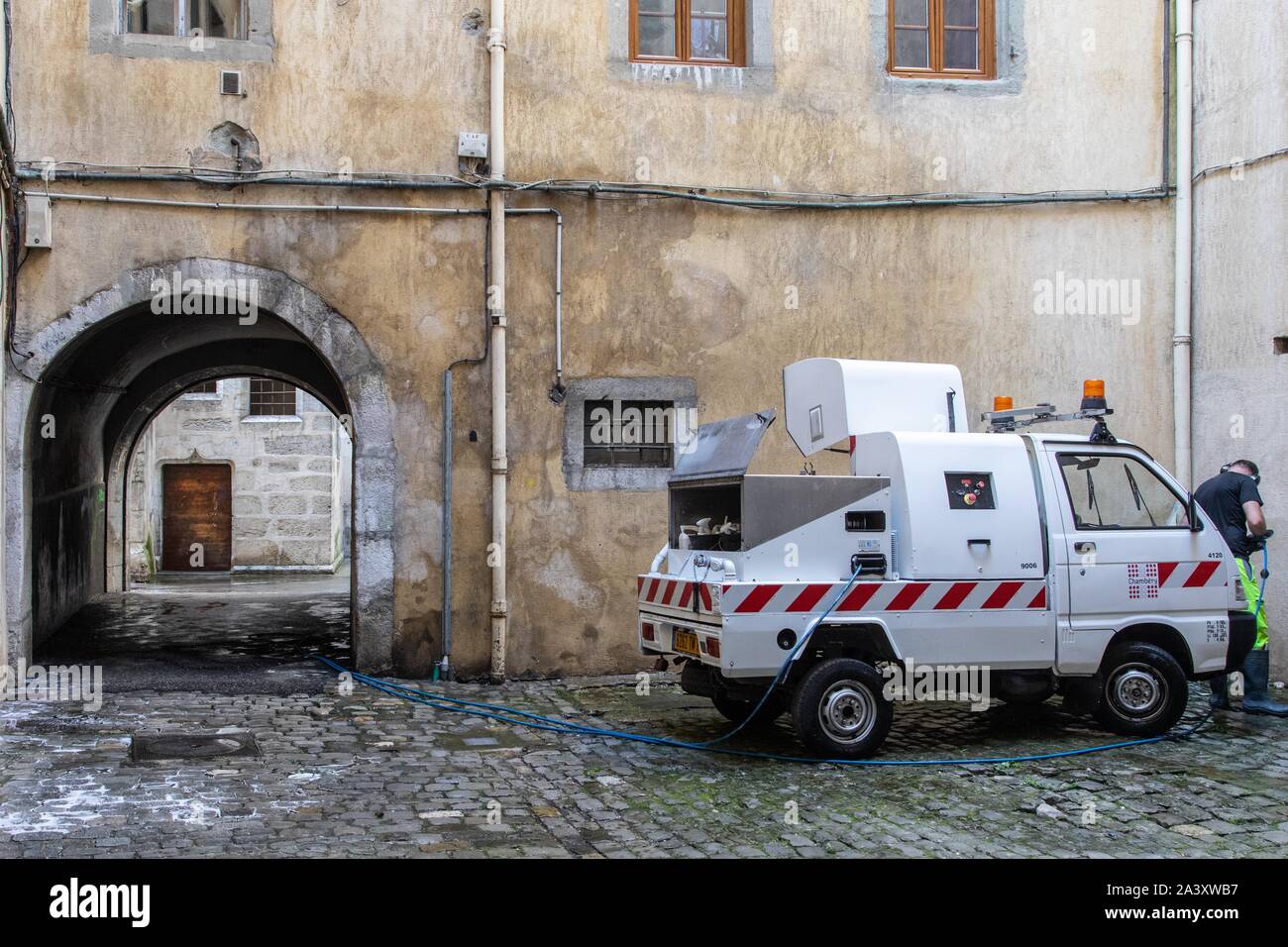 STREET CLEANING TRUCK IN A MEDIEVAL COURTYARD OF CHAMBERY, SAVOY (73), FRANCE Stock Photo