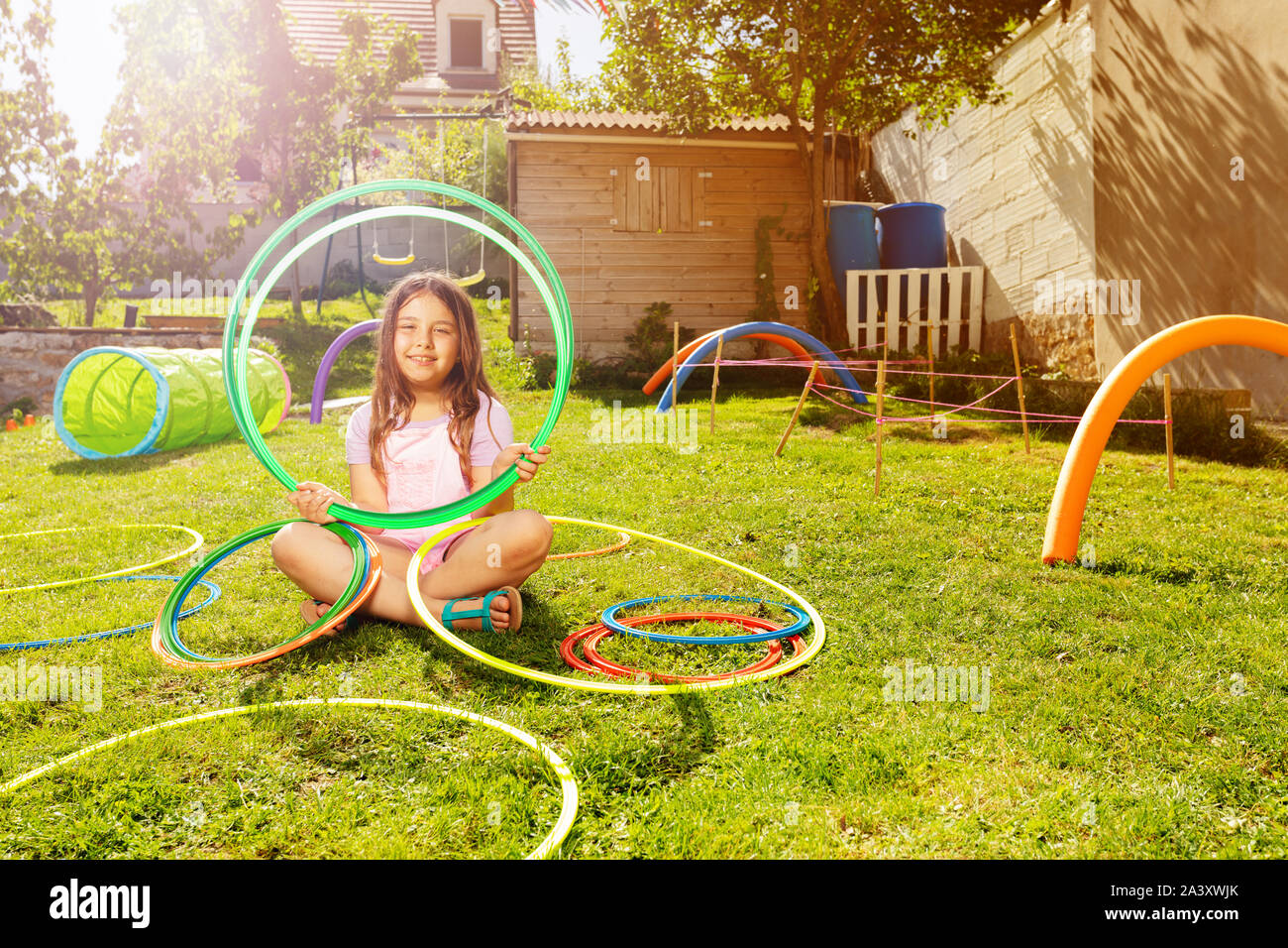 Beautiful girl portrait with hoops on playground Stock Photo