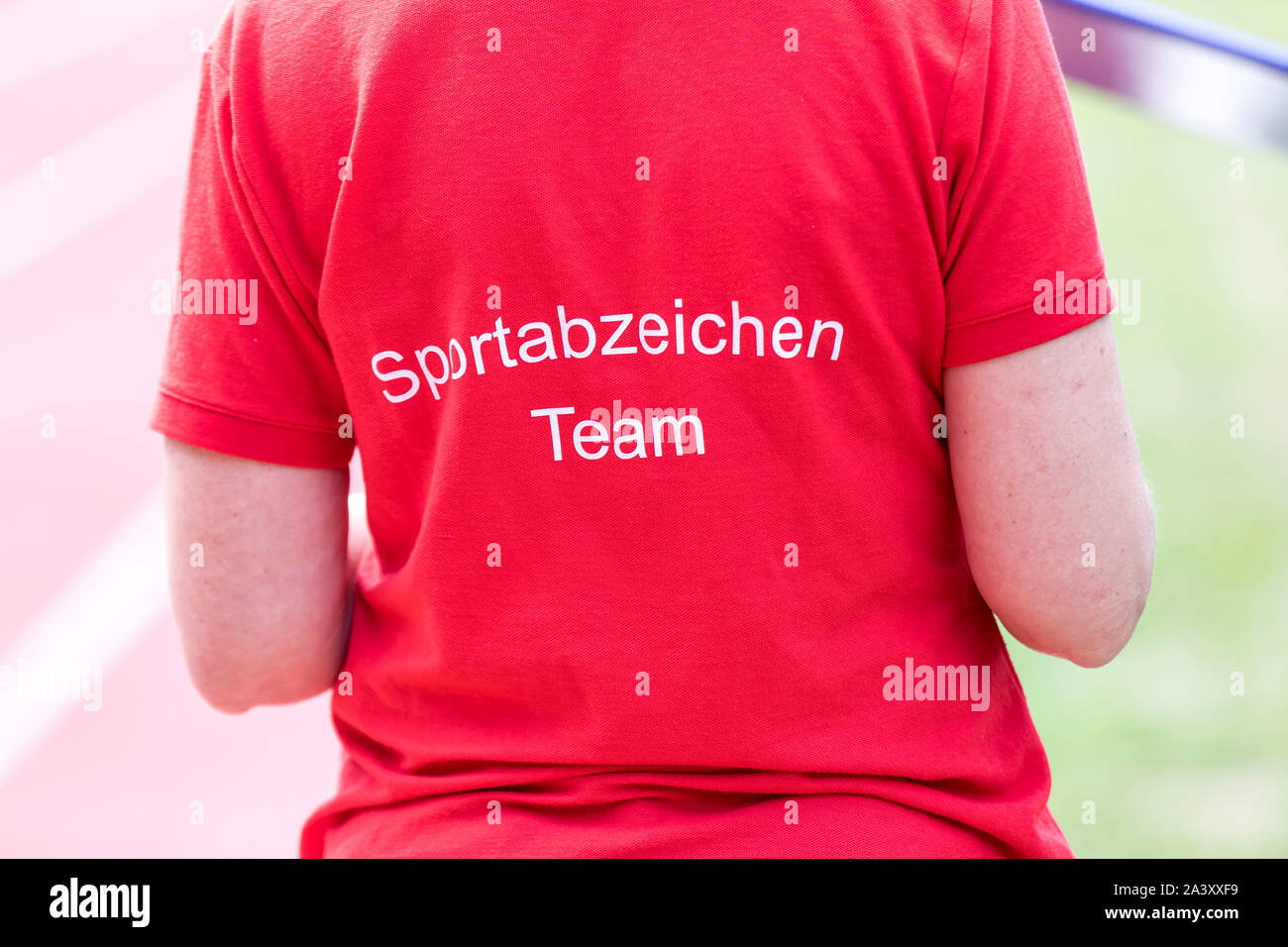 Acceptance of the German sports badge on a sports field, timekeeper, Stock Photo