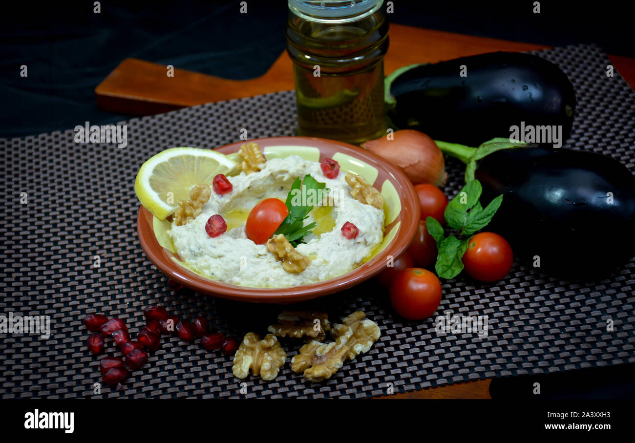 Plate of traditional eastern MUTABBAL. Arabic traditional food . Middle Eastern meze platter. Stock Photo