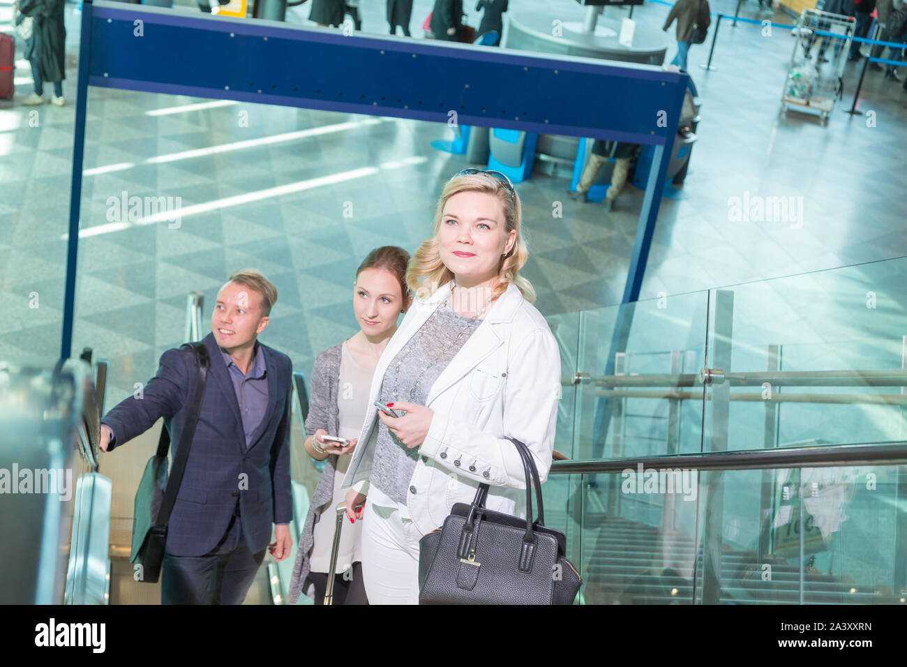 Passengers at the airport Stock Photo - Alamy
