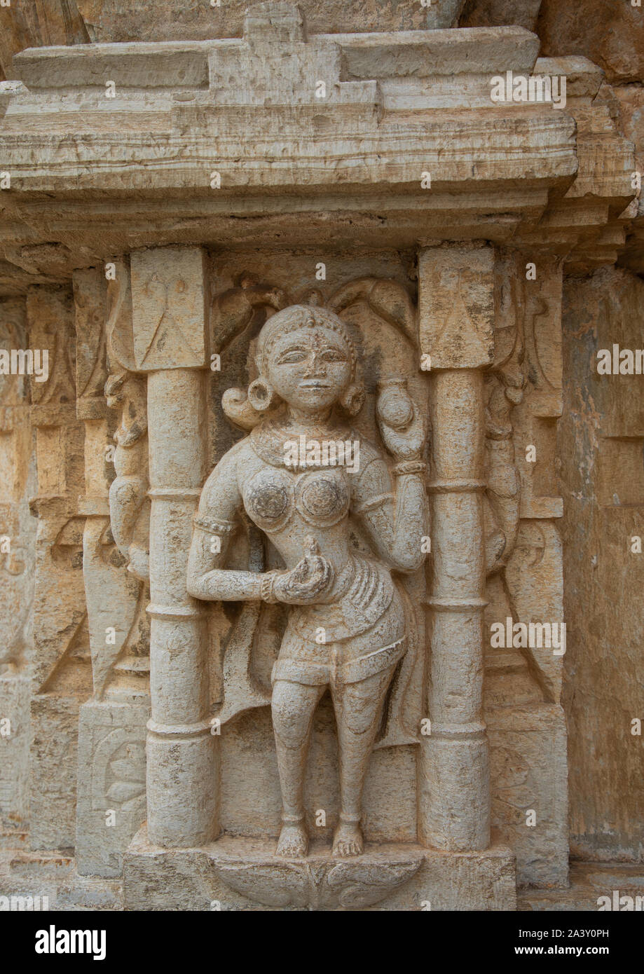 Carved idol on the wall of Vijaya Stambha tower of victory at Chittorgarh fort, Rajasthan, Chittorgarh, India Stock Photo