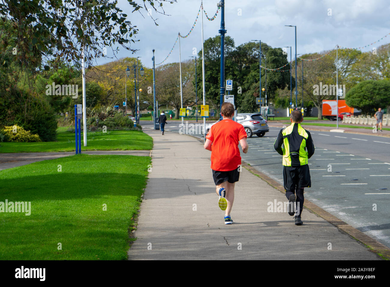 two men running or jogging together Stock Photo