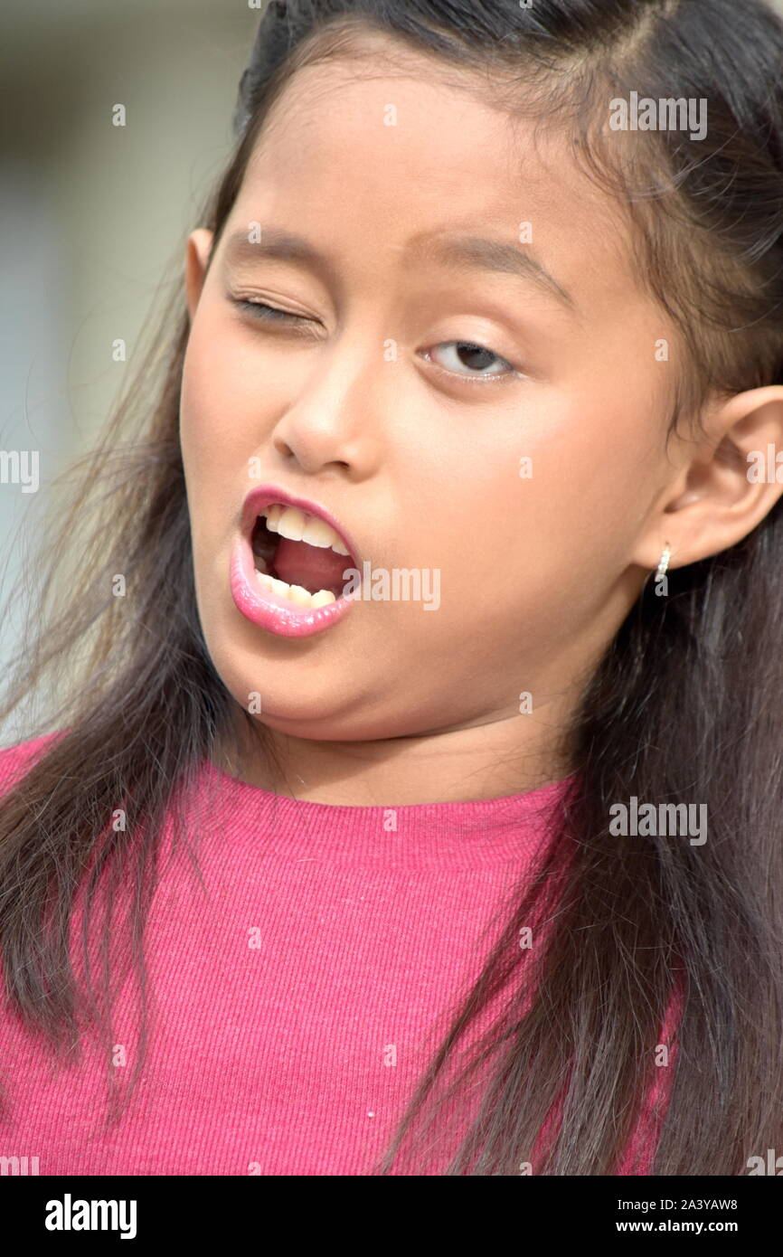 Winking Young Asian Girl Child Stock Photo