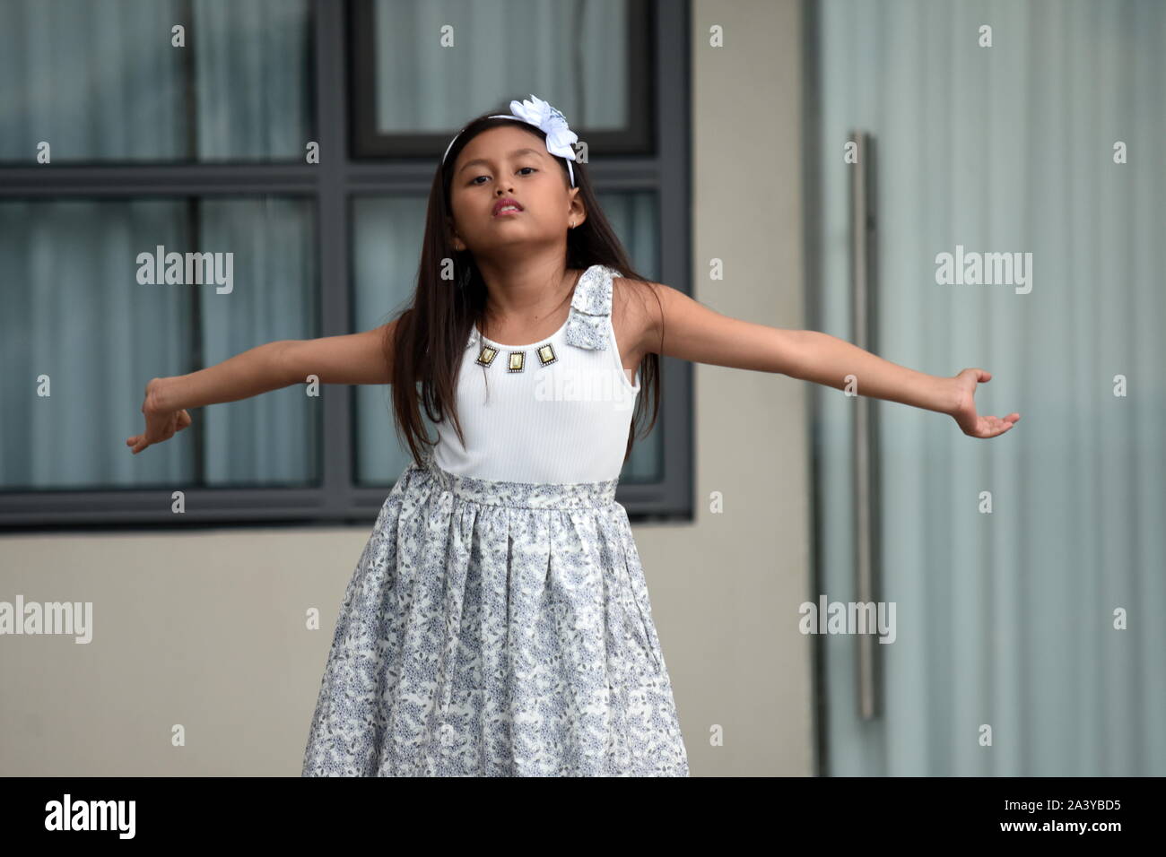 Petite Asian Girl Dancing Wearing Dress Stock Photo