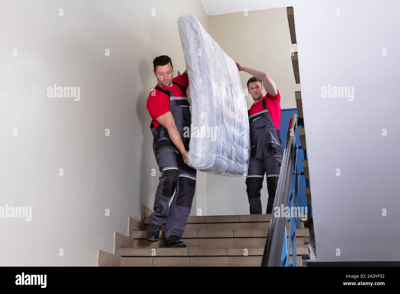 Man carrying mattress hires stock photography and images Alamy