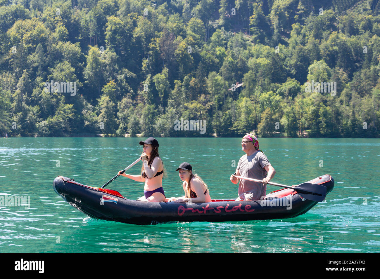 Family on inflatable dingy near Bled Island, Lake Bled, Bled, Upper Carniola Region, Slovenia Stock Photo