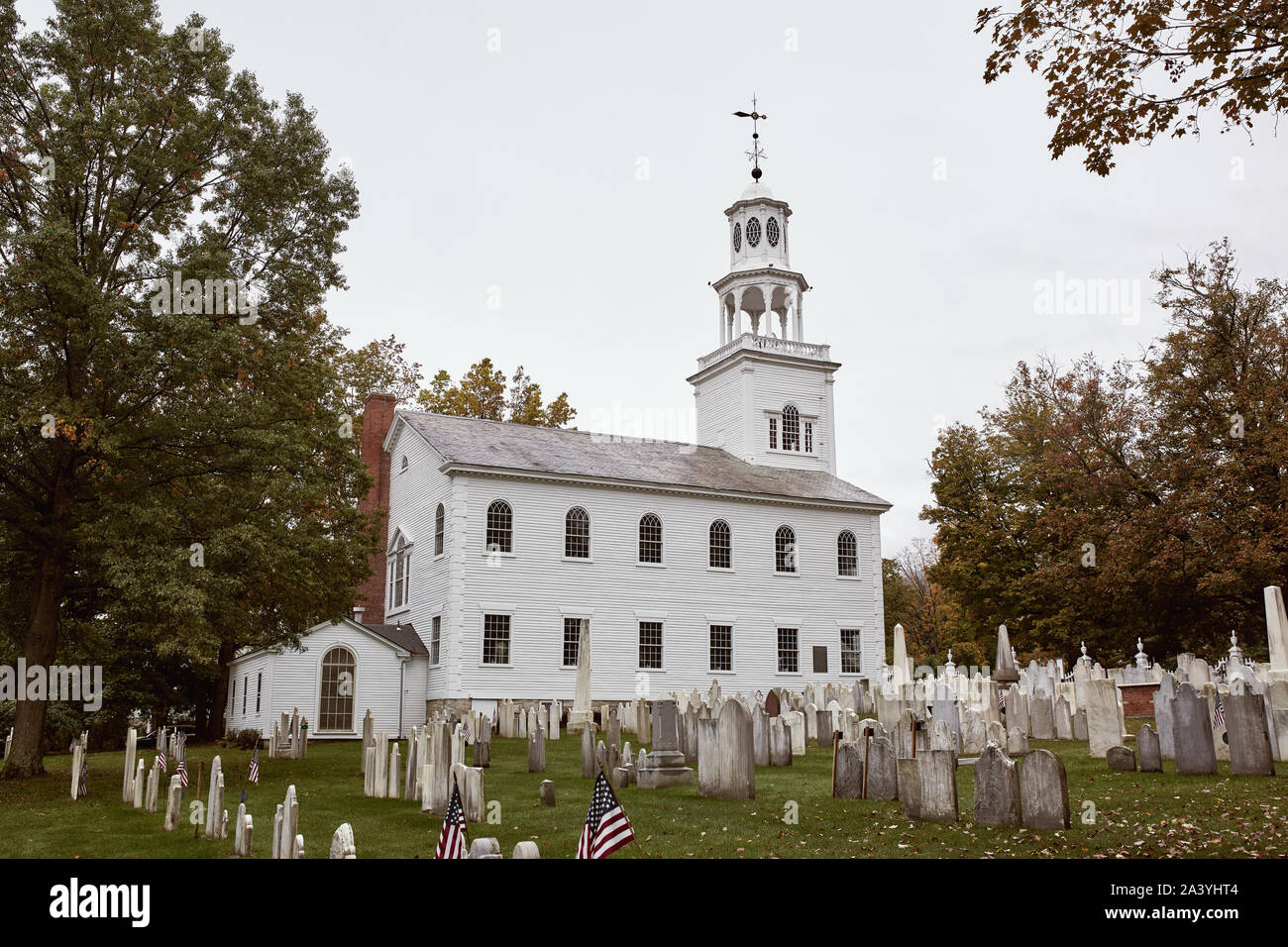 Bennington Centre Cemetery on a cold Fall day with Old First Church in the distance.  Bennington, Vermont Stock Photo
