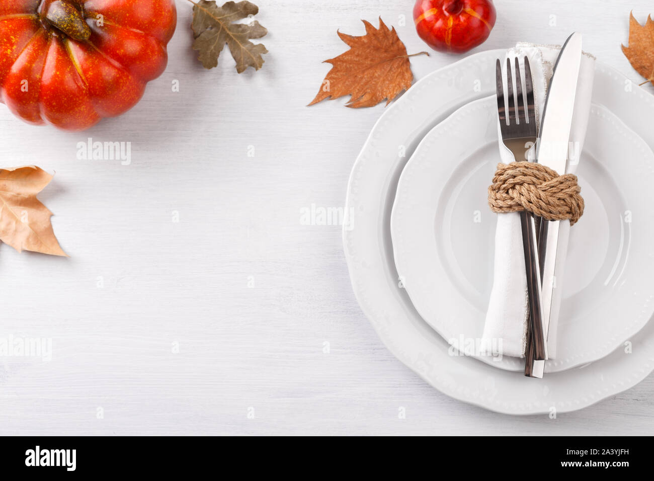 Thanksgiving autumn table setting with decorative pumpkins and dried ...