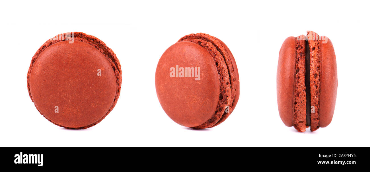 Three chocolate macarons isolated on white background. Stock Photo