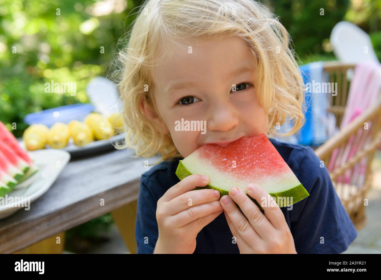 Boy eating watermelon Stock Photo