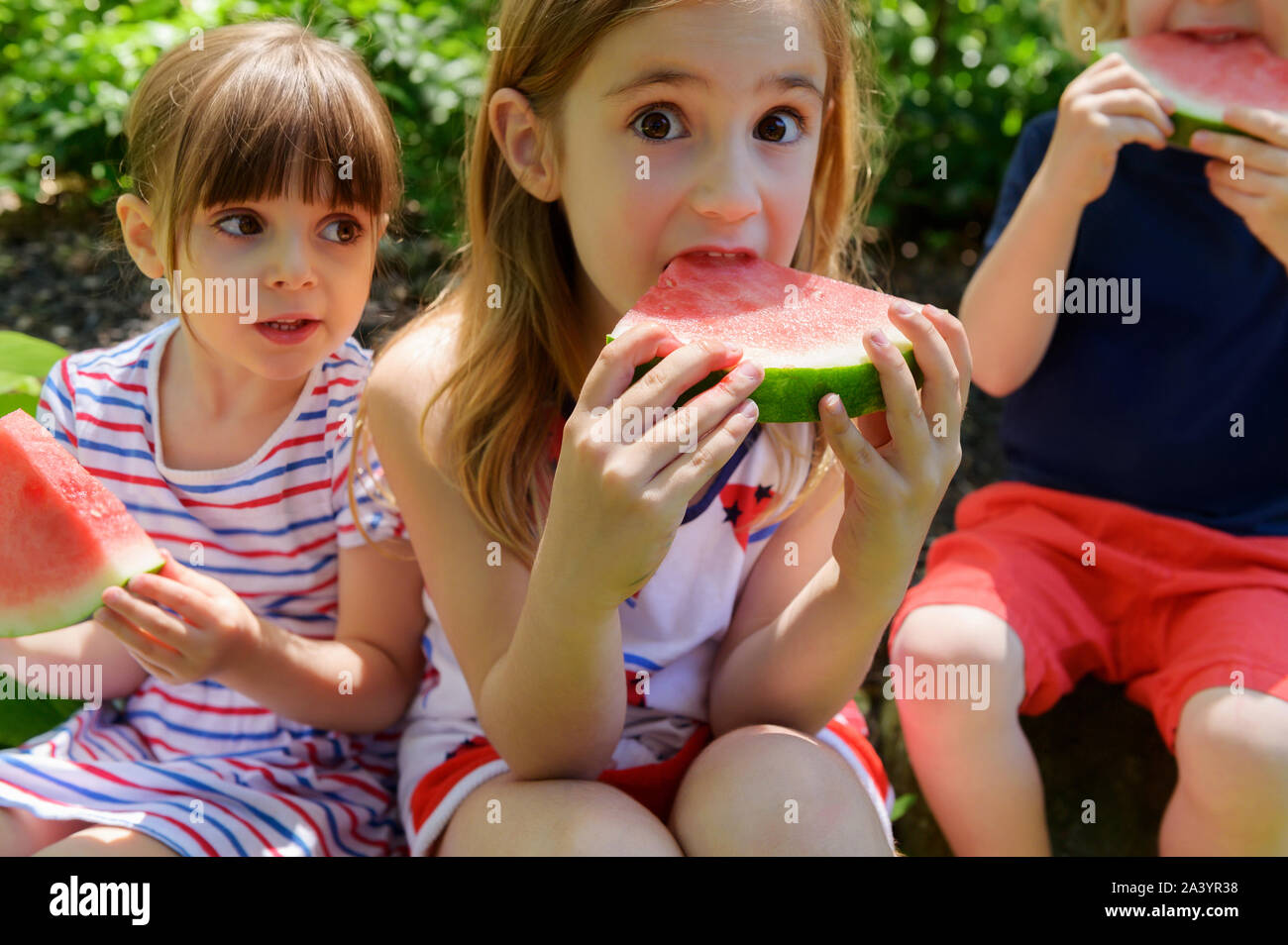 Children eating watermelon Stock Photo