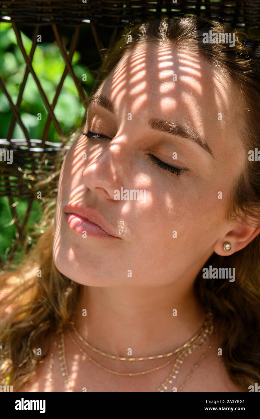 Portrait of young woman with her eyes closed Stock Photo