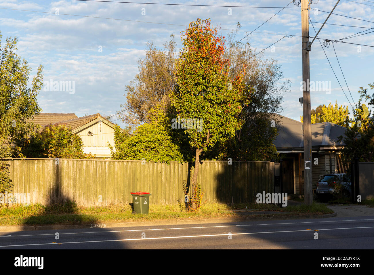 Suburban side street with council wheelie bin waiting to be collected. Stock Photo