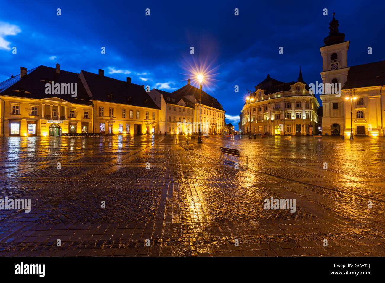 Wet Grand Square at sunset in Sibiu, Romania Stock Photo