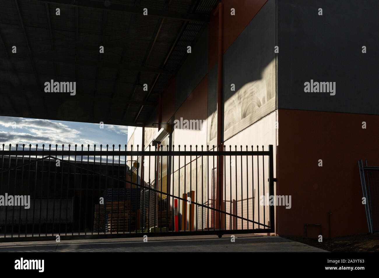 Locked factory facility gate on summers afternoon. Stock Photo