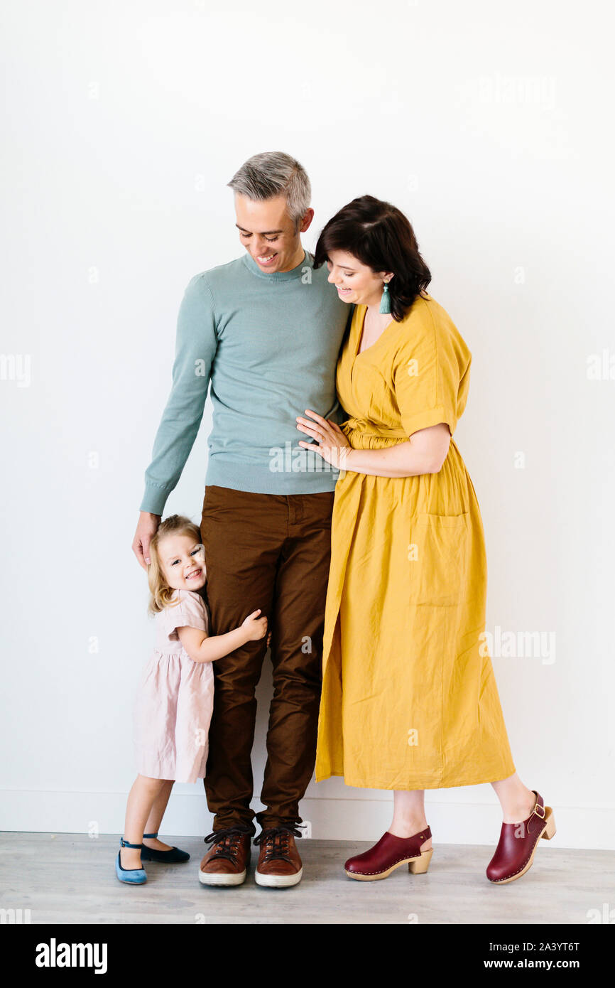 Mid adult couple smiling at their daughter Stock Photo
