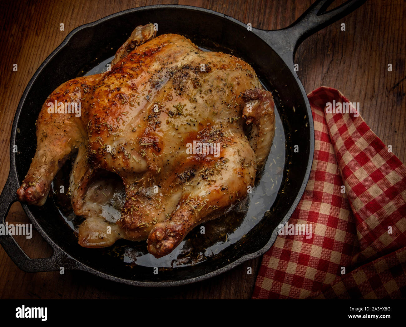Roast chicken in frying pan Stock Photo Alamy