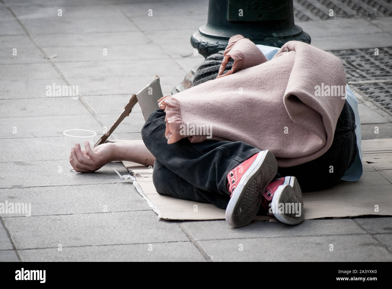 Athens, Greece. 10th Oct, 2019. A homeless person seen sleeping on the sidewalk.World Homeless Day was born out of discussions between aid workers around the world, all of whom were helping the homeless in their own countries. Credit: SOPA Images Limited/Alamy Live News Stock Photo