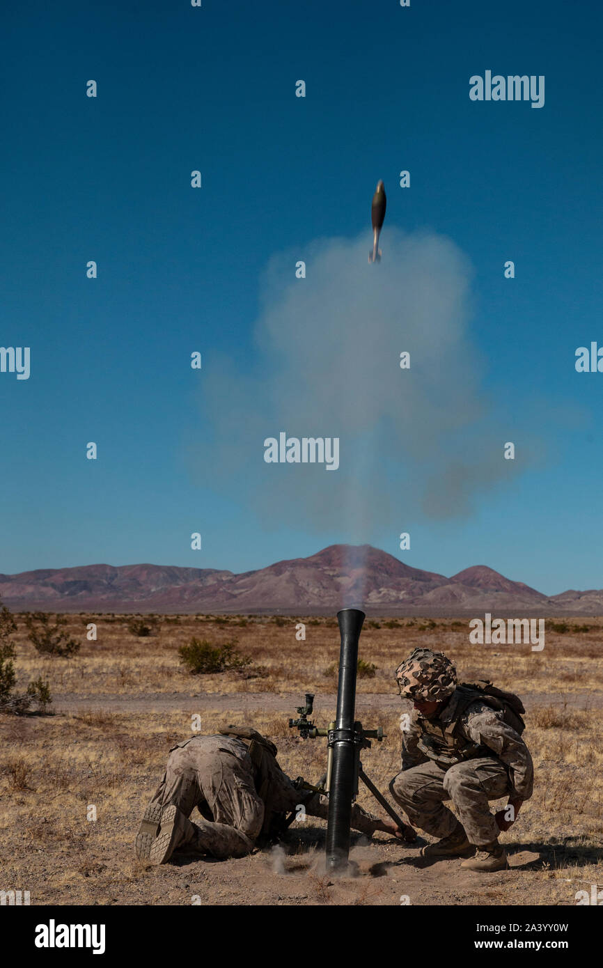 U.S. Marines with 1st Battalion, 6th Marine Regiment, 2d MarDiv fire M252 81mm mortar systems for a Fire Support Coordination Exercise during Integrated Training Exercise (ITX) 1-20 on Marine Air Ground Combat Center, Twenty-Nine Palms, California, Oct. 4, 2019. The Marines were coordinated by forward observers in Fire Support Teams in conjunction with M777-A2 Howitzers and rotary elements to train for success on a modern battlefield. (U.S. Marine Corps photo by Cpl. Timothy J. Lutz) Stock Photo