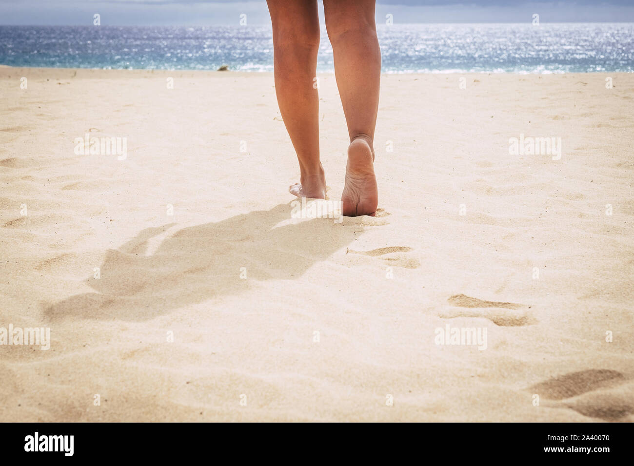 Barefoot woman walking hi-res stock photography and images - Alamy